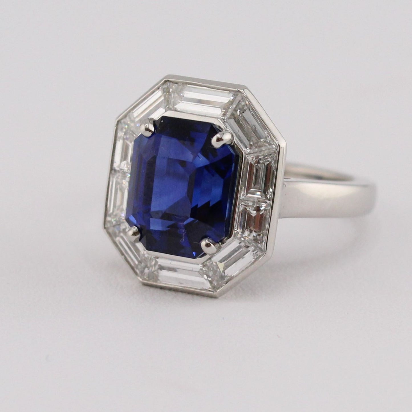 Certified Sri Lankan Royal Blue Sapphire Ring with Bezel Finish Trapezoid Cut Diamond Halo